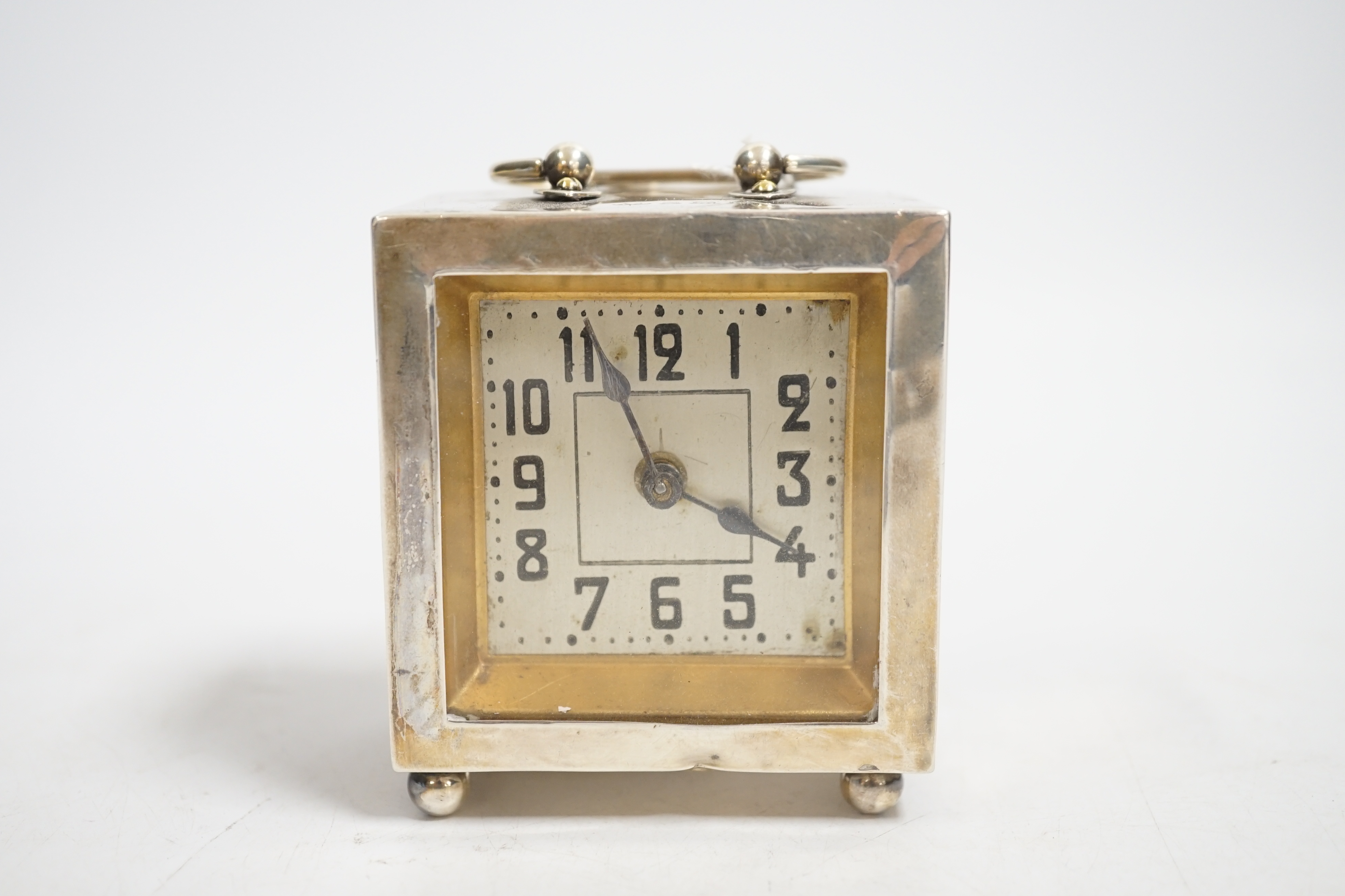 A George V silver rectangular carriage timepiece, with Arabic dial, maker LH, Birmingham, 1912, 72mm excluding handle.